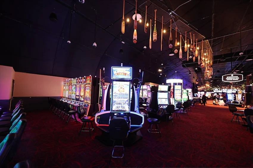 Gaming machines and pendant lighting inside The Temporary by American Place