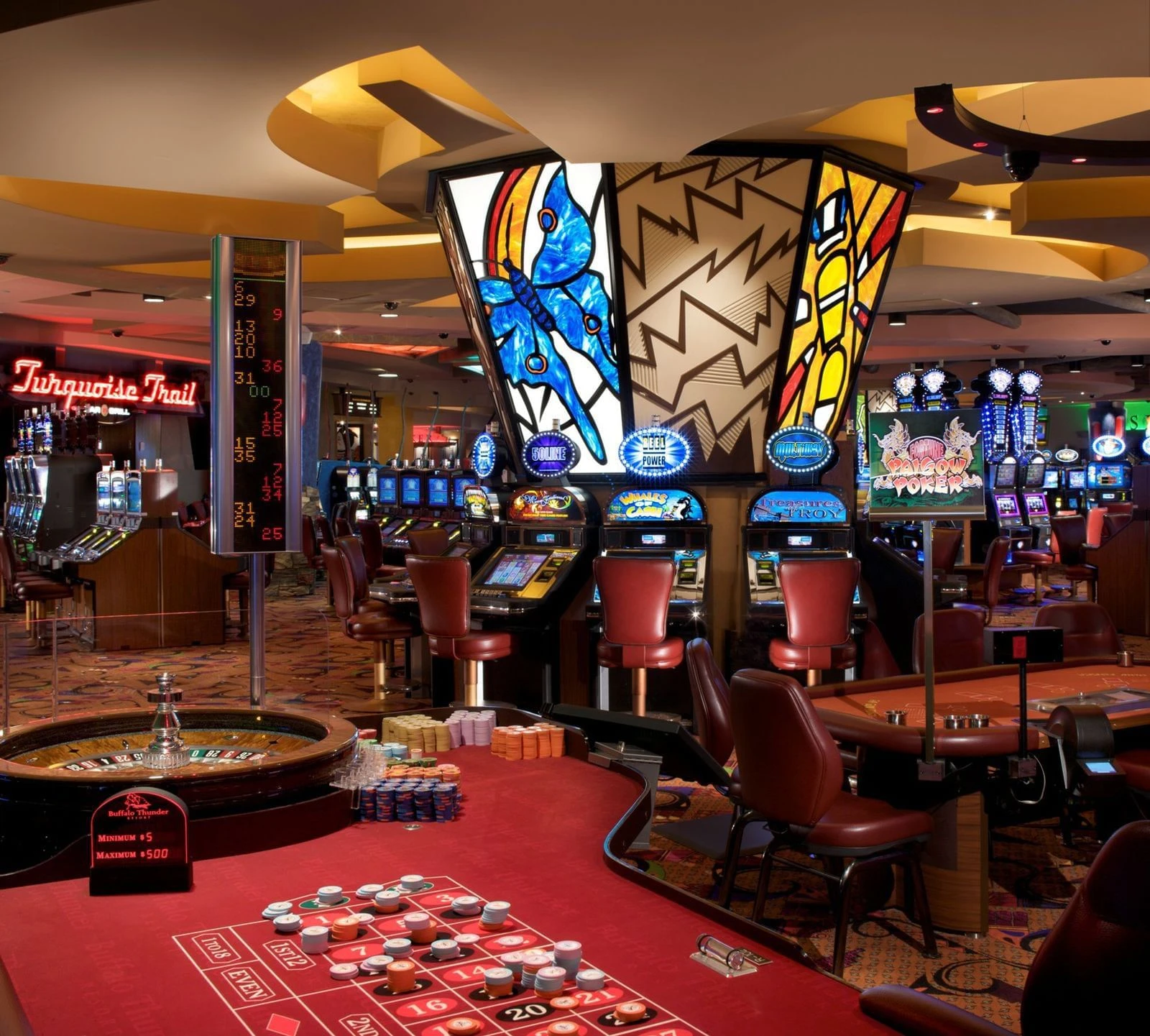 Existing Buffalo Thunder casino interior with gaming tables and slot machines