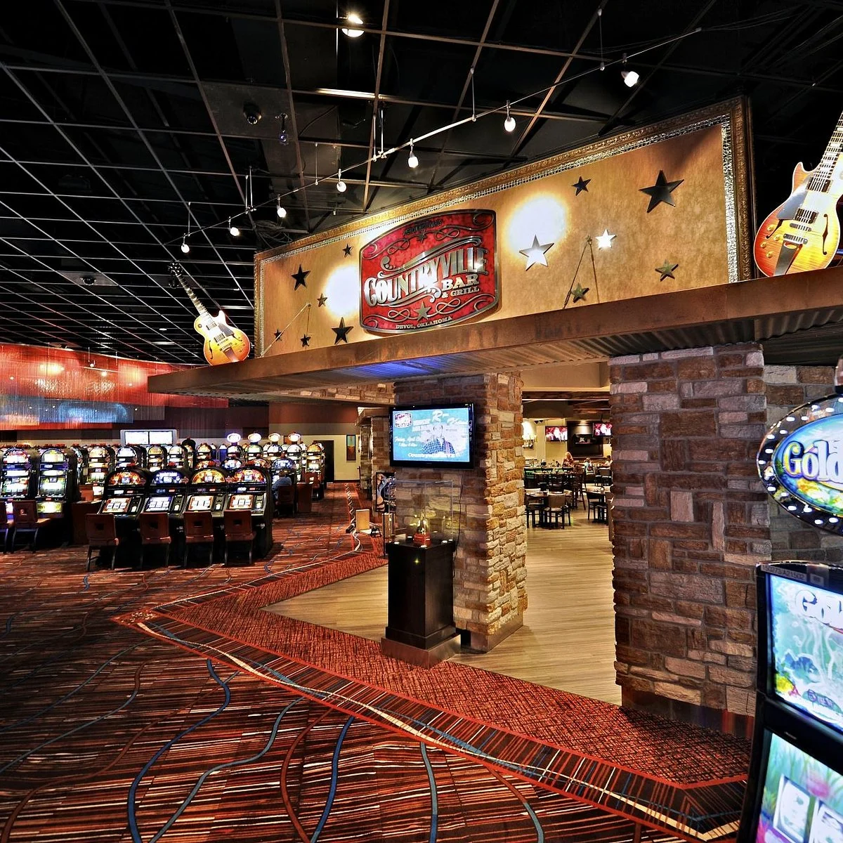 Slot machines and the Countryville Bar and Grill entrance at Comanche Red River Casino