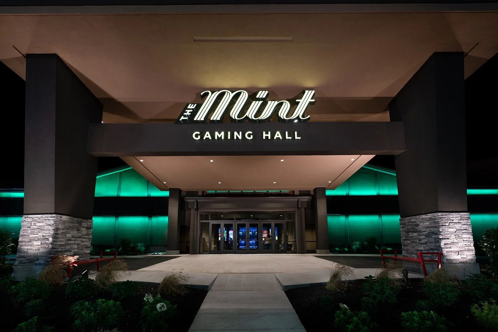 The Mint Gaming Hall entrance illuminated at night