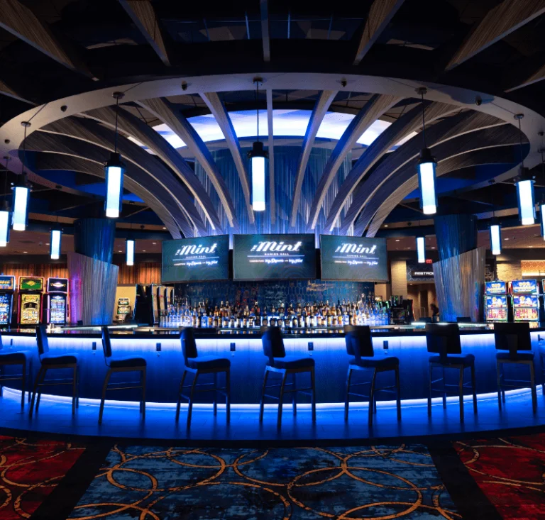 Bar and seating with blue lighting at The Mint Gaming Hall Cumberland