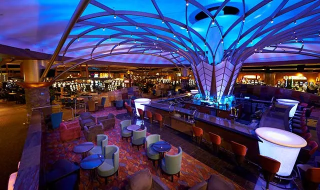 Potawatomi Casino Hotel interior with seating and a blue illuminated ceiling